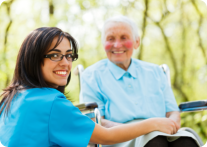 Caregiver and old lady on a wheelchair